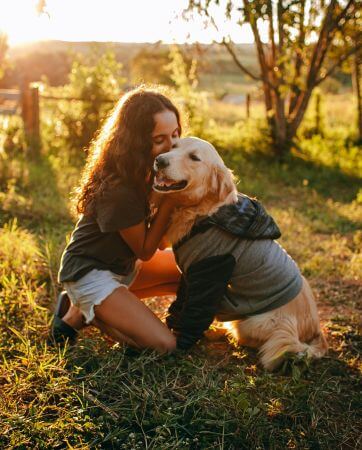 Young girl with her golden retriever