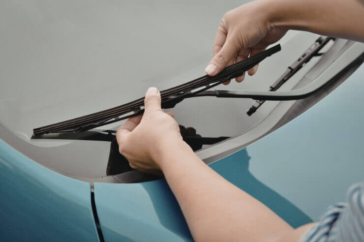 Car Wipers getting changed Blue car having it’s wiper blades changed