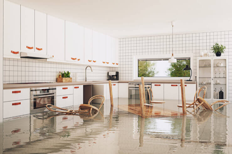 Large white kitchen that has been flooded