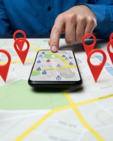 Person using navigation app with map pins on a smartphone