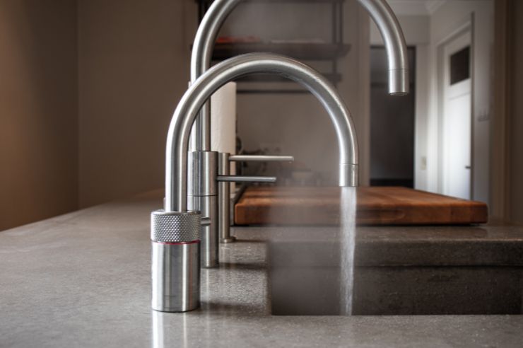 Hot water tap Granite countertops with built in silver boiling water taps