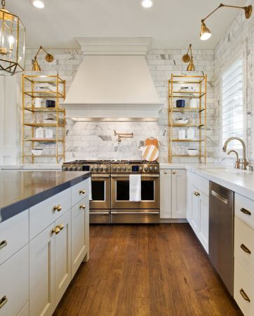 White kitchen with brass coloured accessories