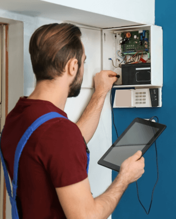 Man installing a home alarm system