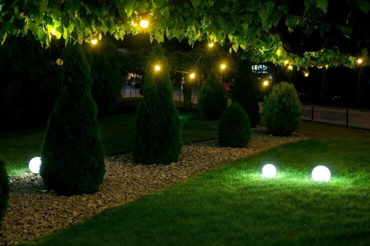 Garden at night Back garden at nighttime with fairy lights and round solar-powered lights
