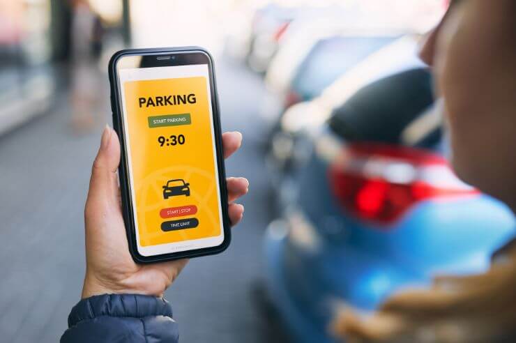 Parking Price Driver using mobile parking app to pay for parking