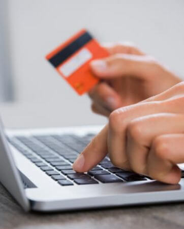 Person making a payment with their bank card online