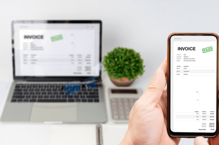 paying Invoice online Invoice that has been marked as paid displayed on laptop and mobile phone