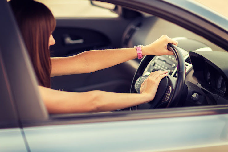 Woman driving and pressing steering wheel | Stay stress-free while driving | An Post Insurance X | Avoiding road-rage | An Post Insurance