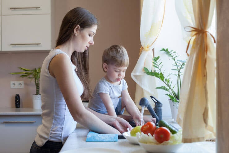 Woman and child washing up at sink | Funeral Insurance | An Post Insurance