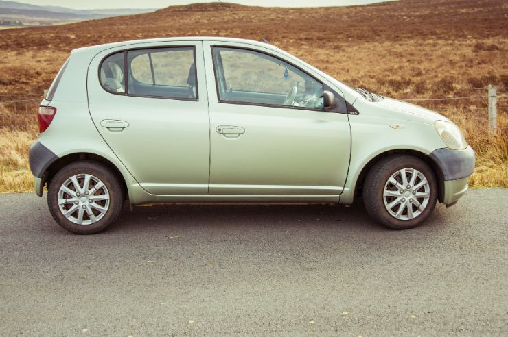 YARIS Silver Toyota Yaris against mountain
