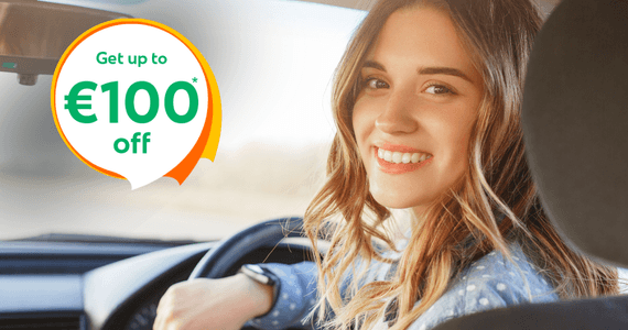 Woman smiling from the driver’s seat with text “Car Insurance for great value and great cover” and “Get up to €80 off”, promoting car insurance in Ireland.