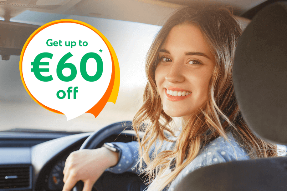 Smiling woman sitting in the driver’s seat of a car with text overlay “Get up to €60 off”, promoting car insurance savings in Ireland.